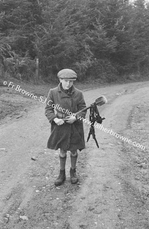 BOY WITH ANIMAL TRAP